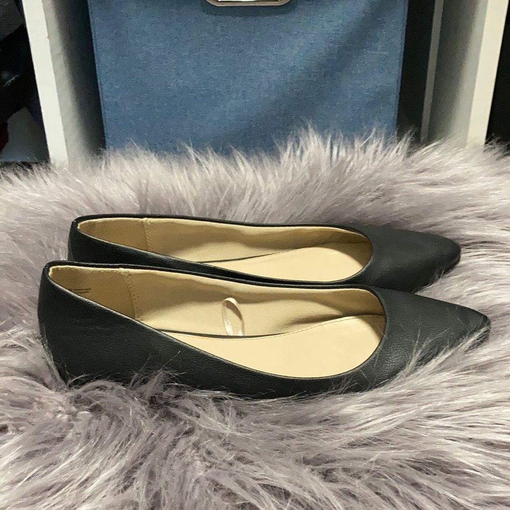 Pair of black Express size 8 flats.